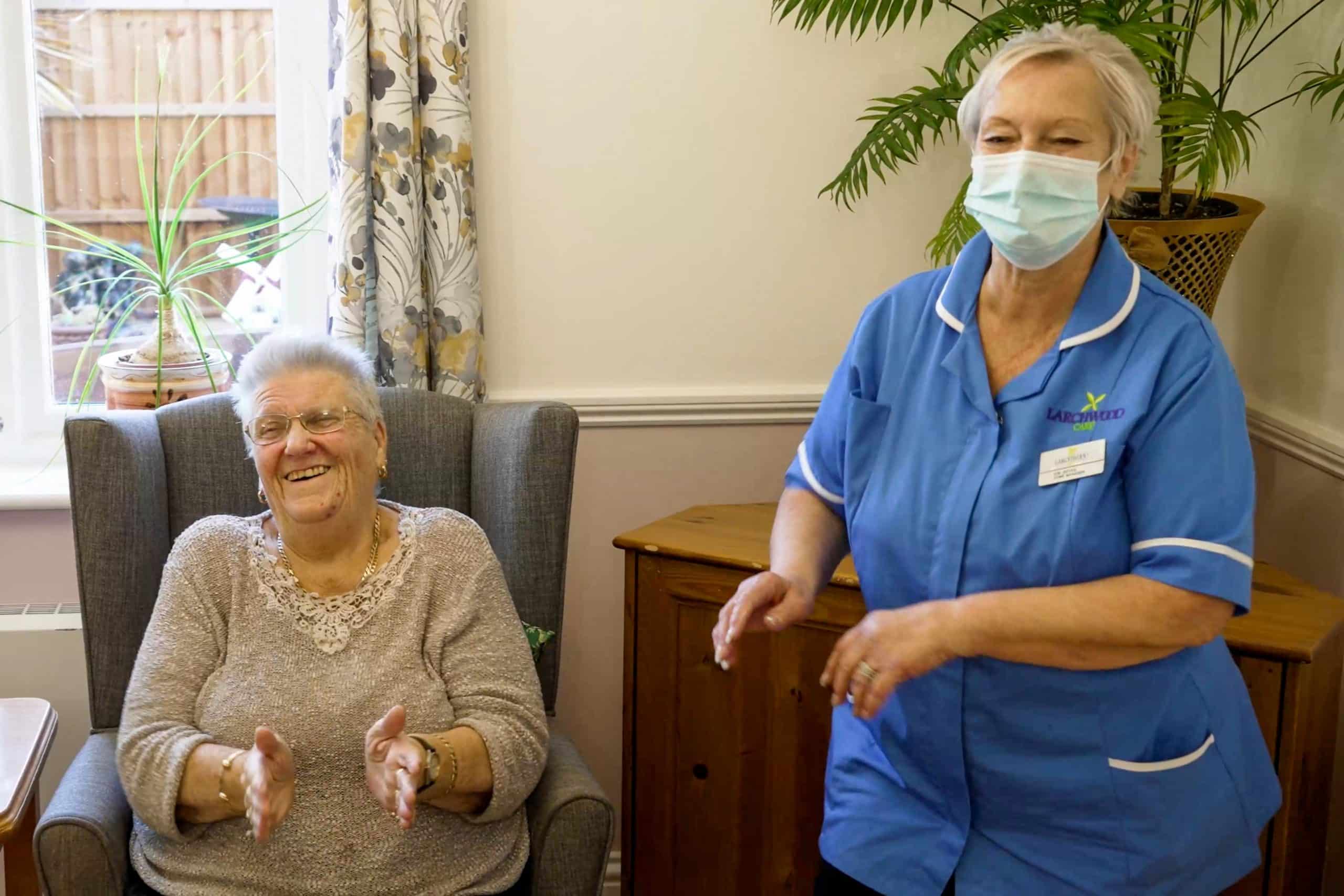 Resident and team member dancing at Basildon care home Cameron House.