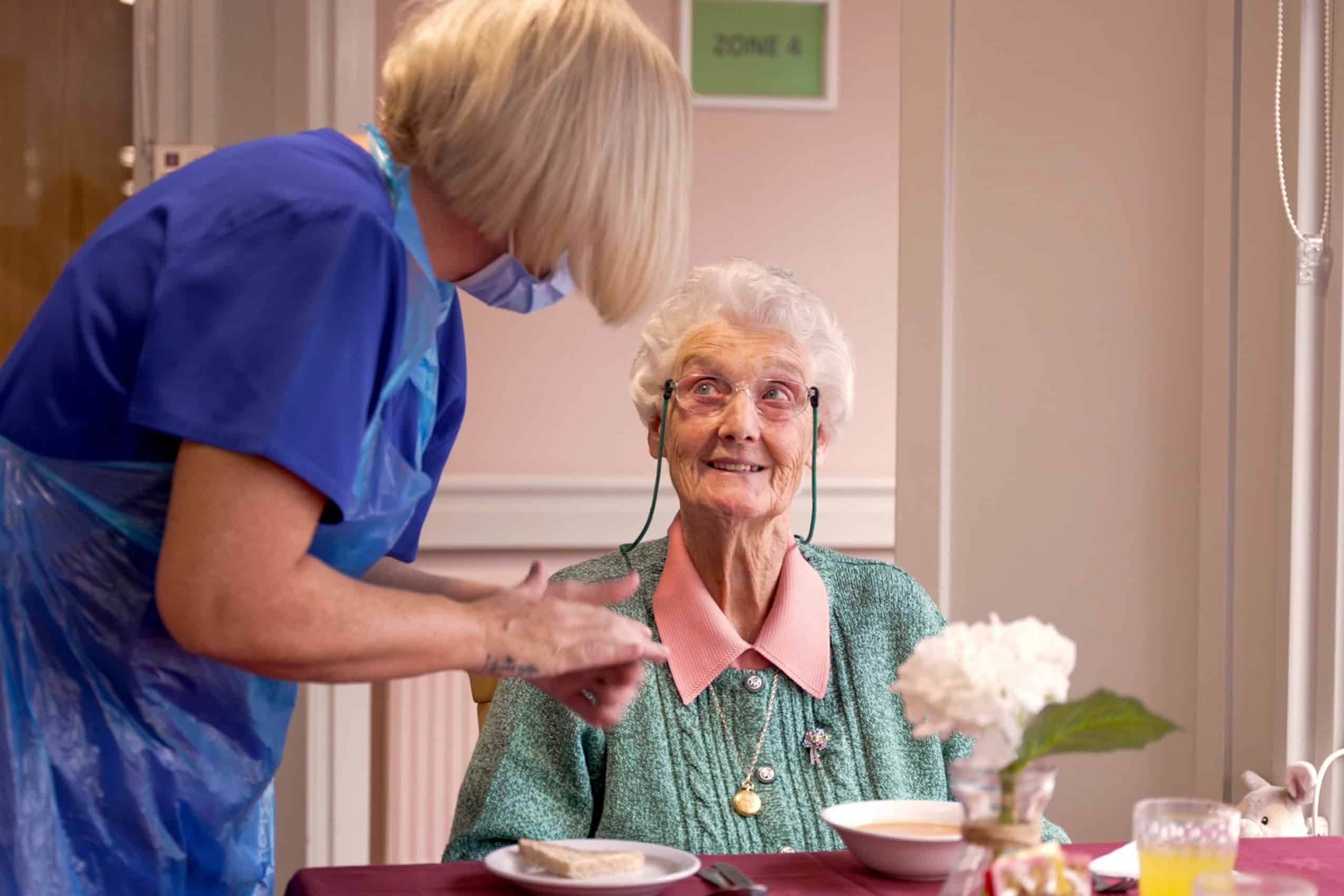 Resident and team member during a mealtime at Cranford Care Home in Aberdeen.
