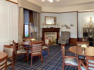 Cranford Care Home Aberdeen, front of house lounge with character fireplace.