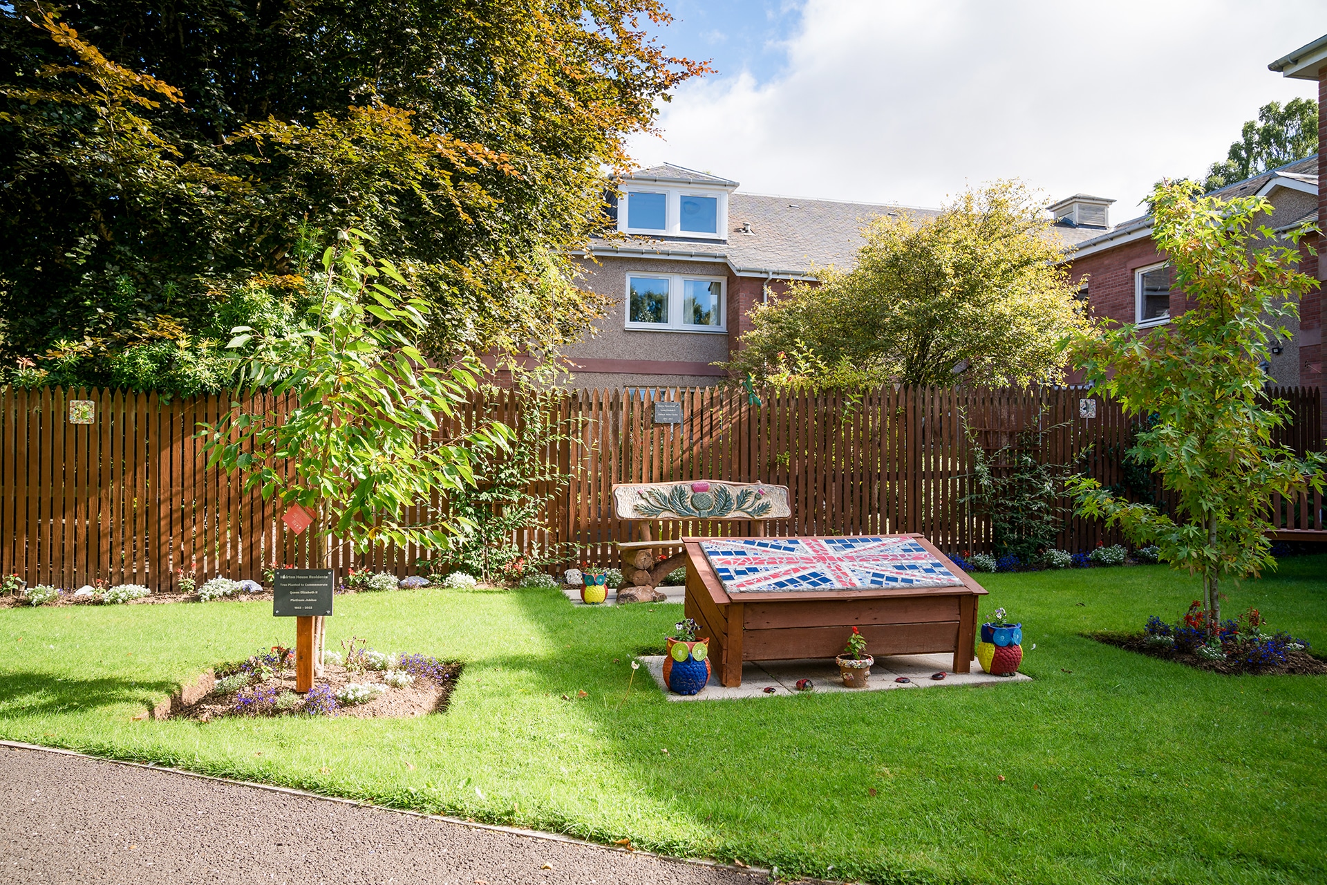 The Platinum Jubilee Garden at Muirton House Care Home featuring a Union Jack mural made by some of the homes residents and local arts groups.