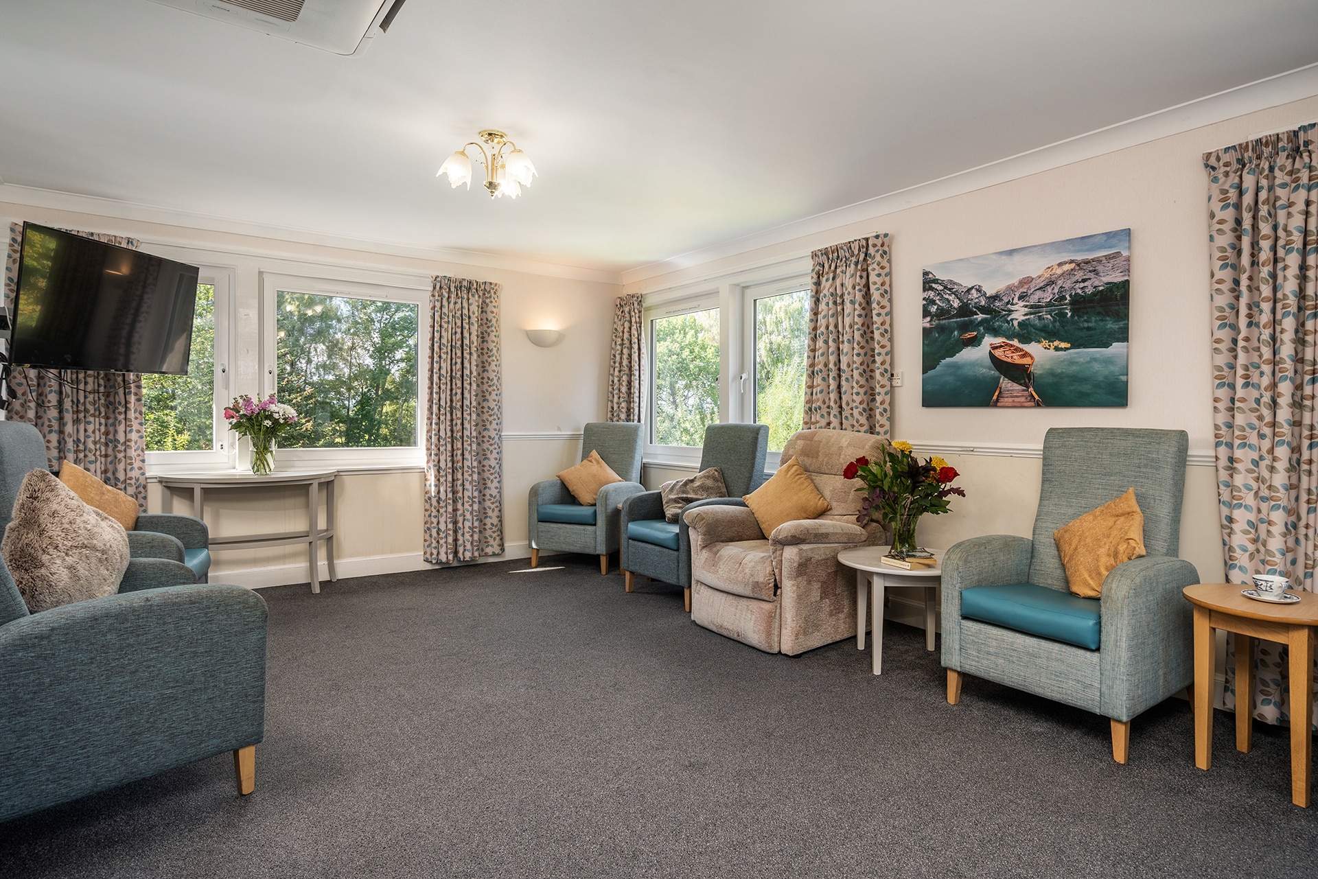 The first floor lounge at Muirton House Care Home with views across the putting green, garden and surrounding countryside.