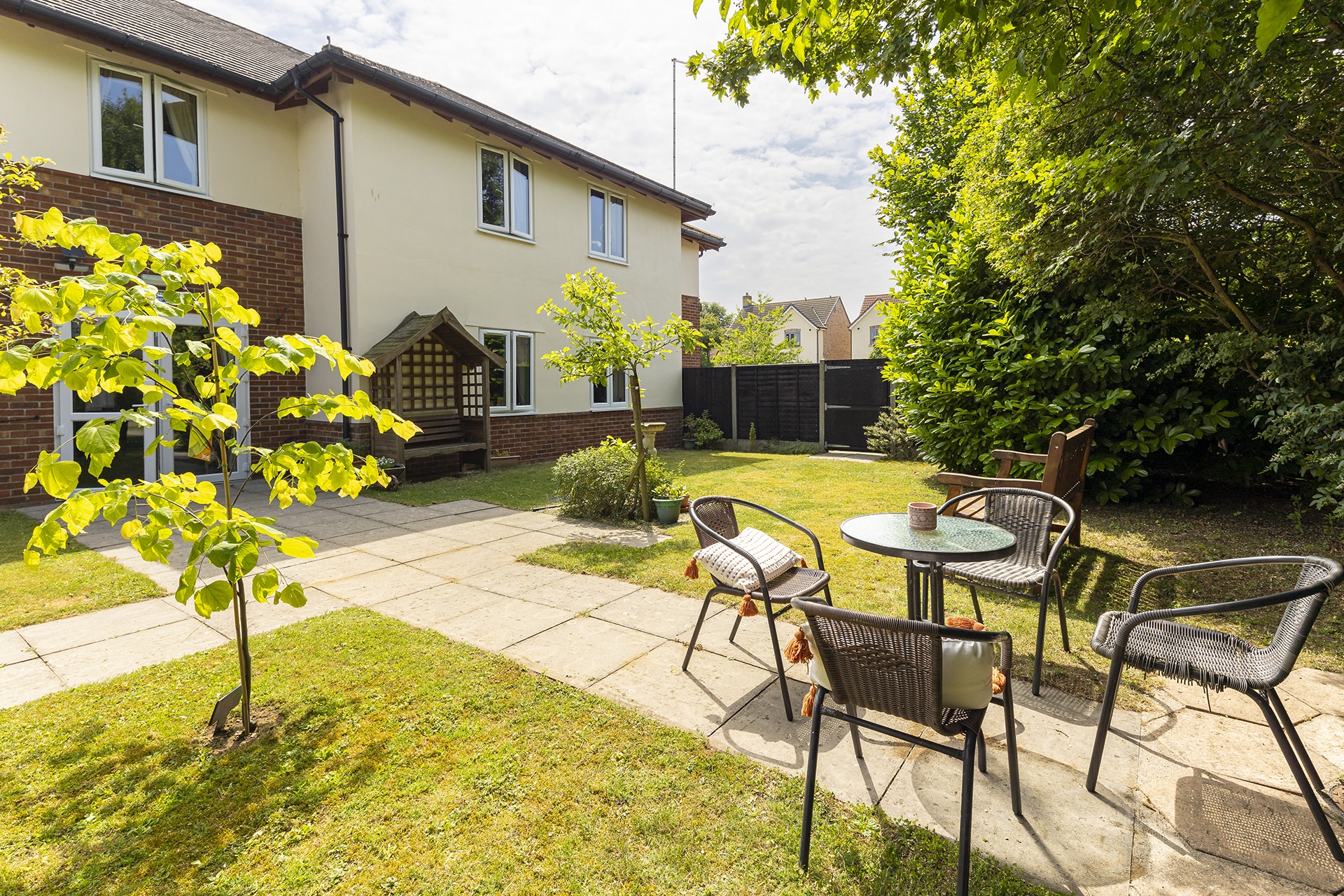 One of the many seating areas in the garden at Lily House Care Home in Ely.