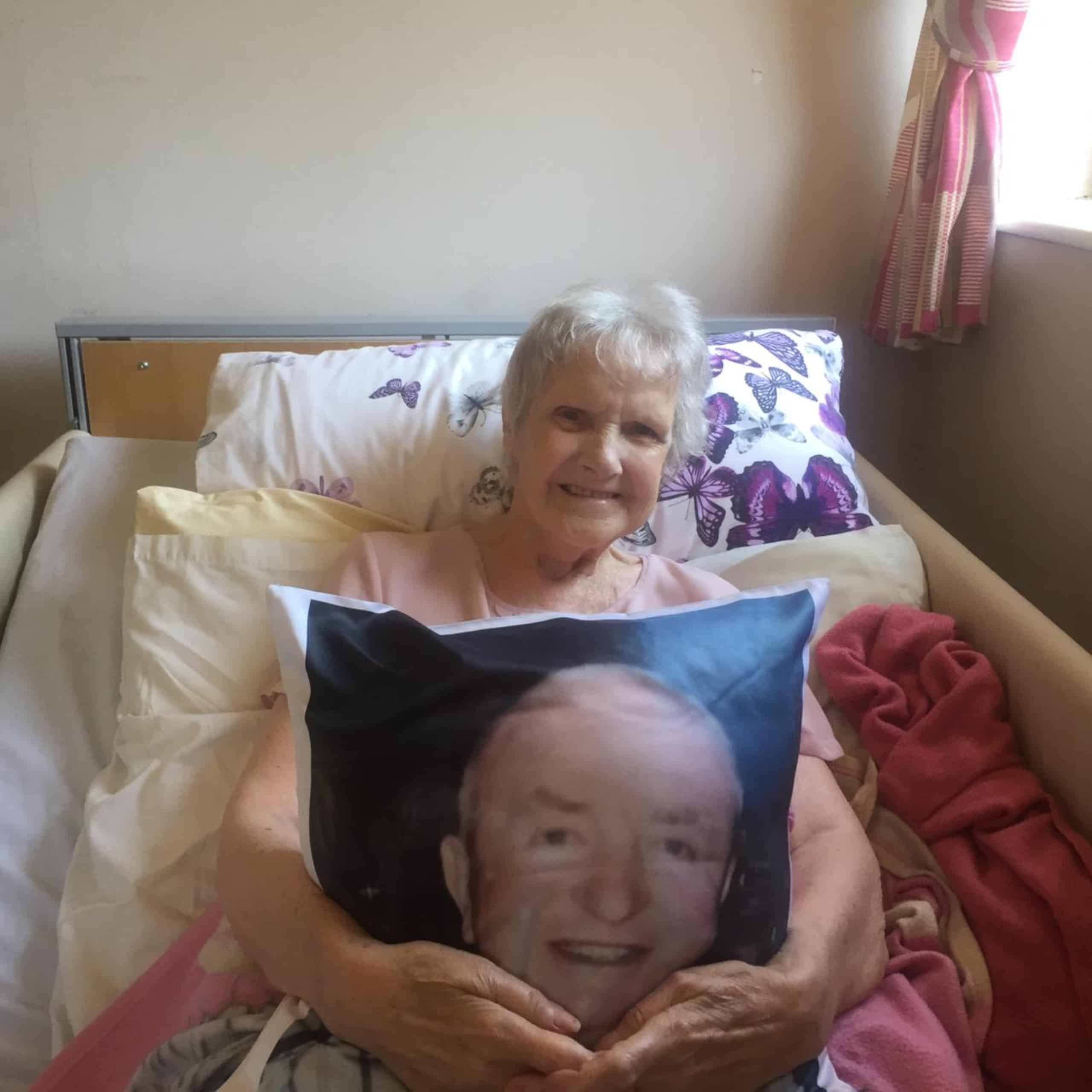 Hope House Care Home resident Sheila O’Connor with her photo pillow of Tony.