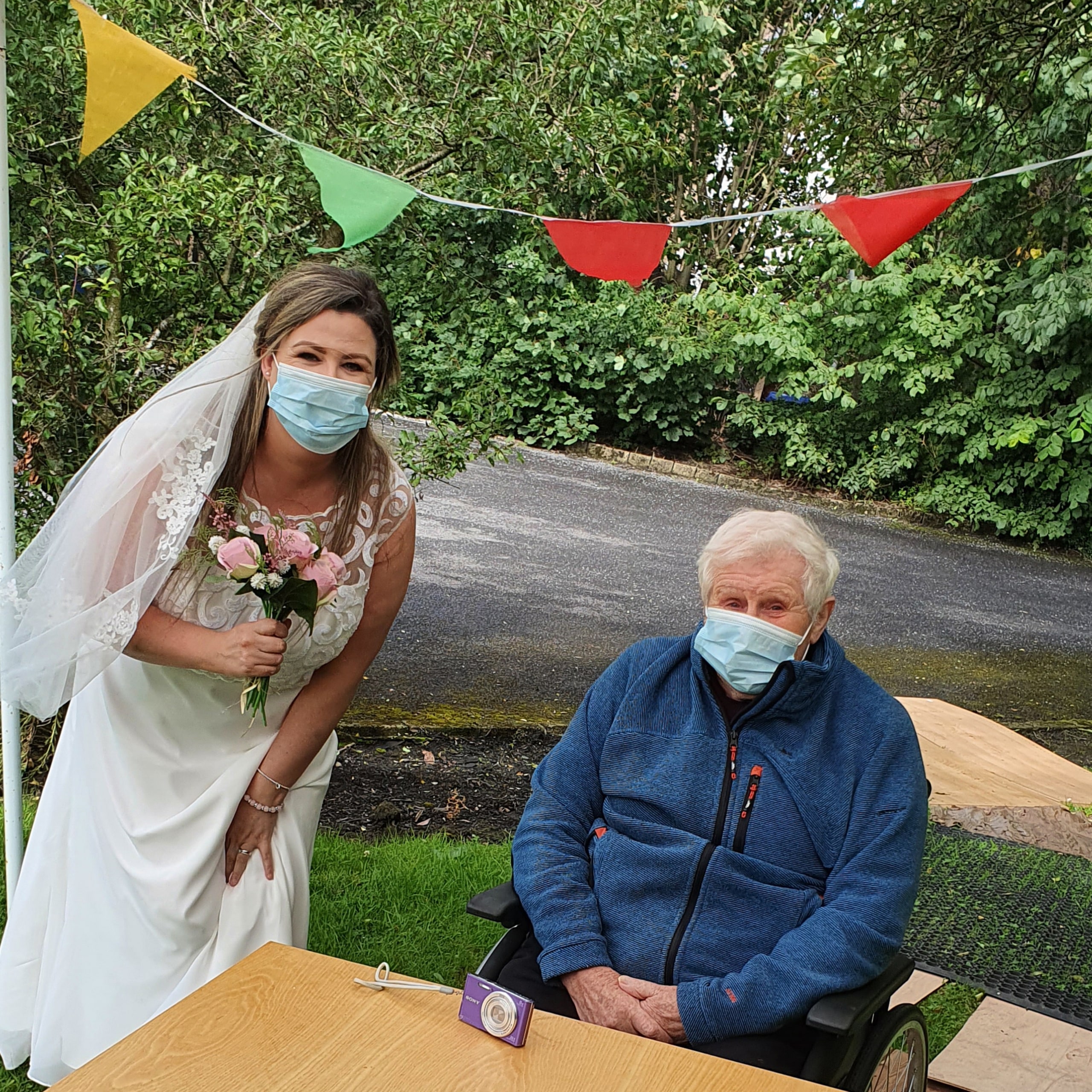 Resident at Hope House Care Home in Accrington with his granddaughter on her wedding day,