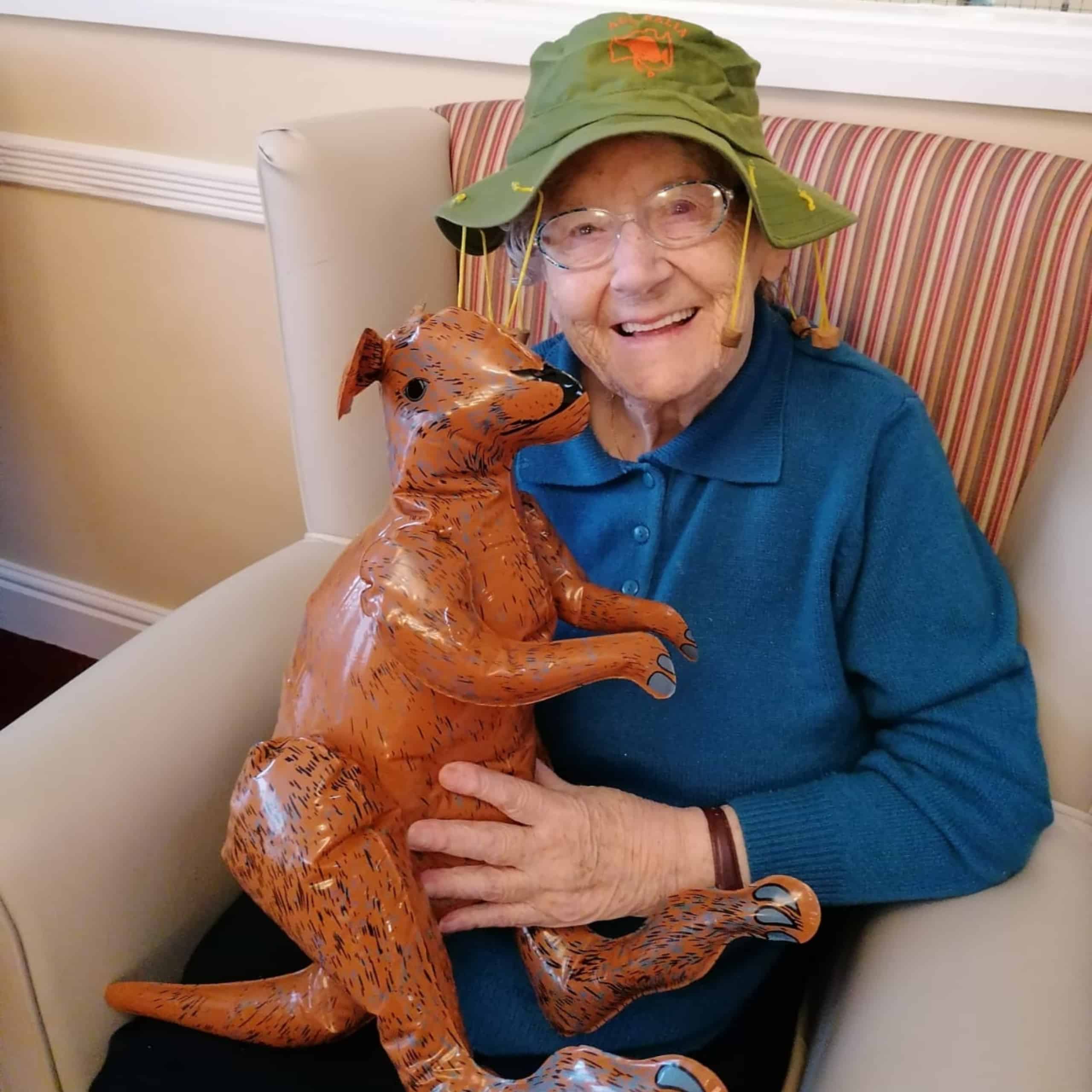 Atherton care home resident Sybil Downham enjoying the Australia Day celebrations at The Chanters with a cork hat and inflatable kangaroo.