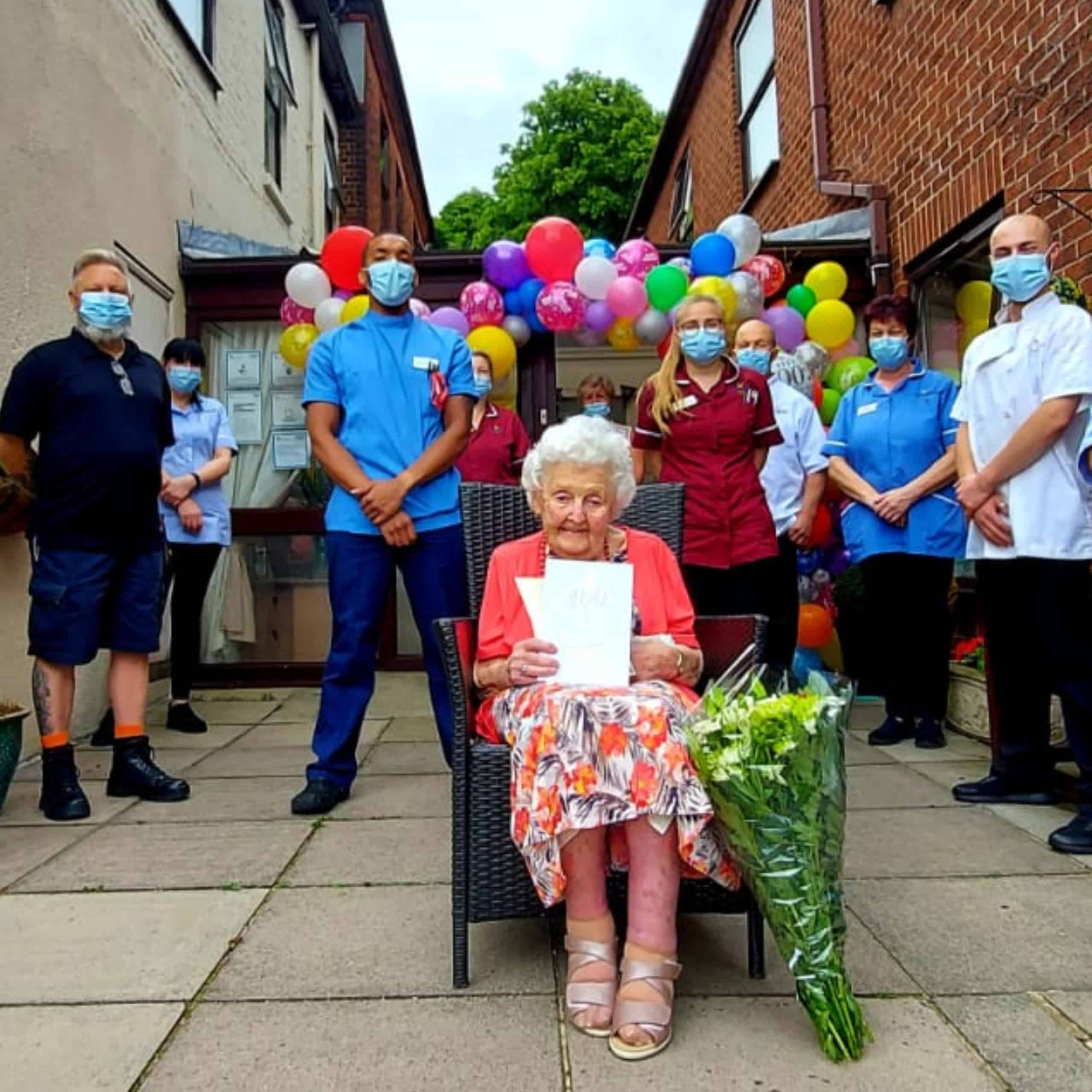 Norwich care home resident Ruby Baker with the guard of honour from Hillcrest Care Home.